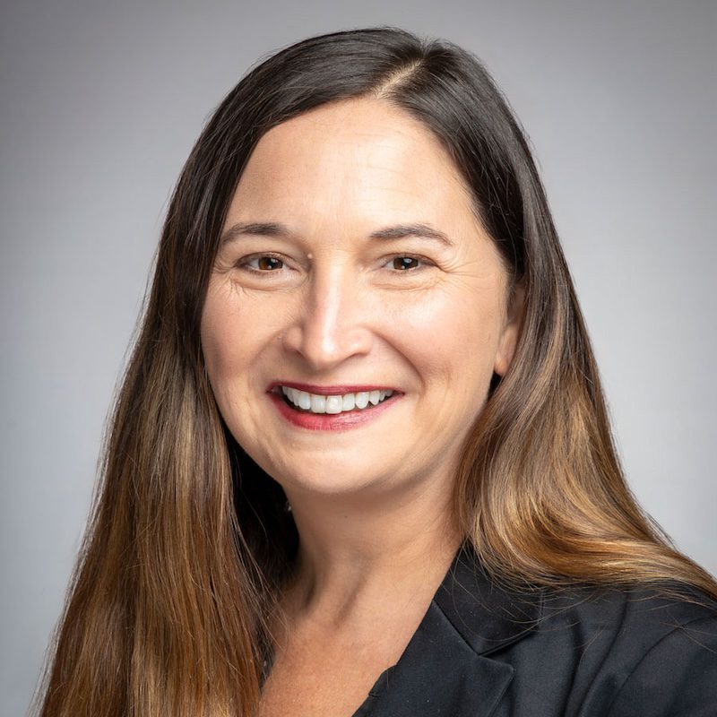 Smiling headshot of Brook Vernon, Workforce Development Programs Manager for the Building Performance Association. Taken in 2024