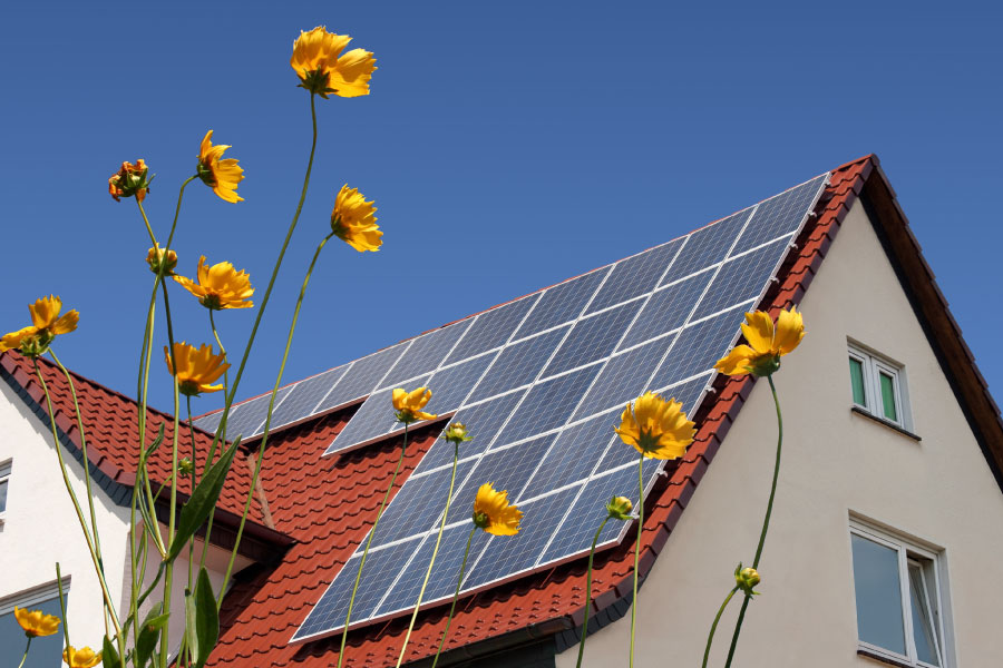 Photo of a home with solar panes installed.