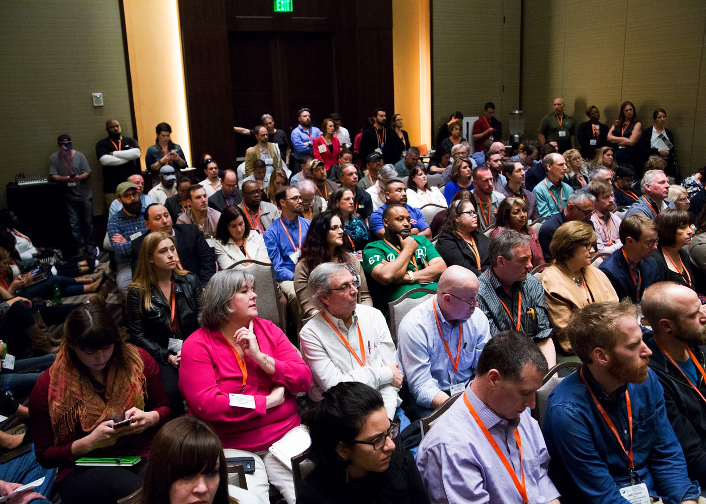 A room full of people listen in to an educational session at NHPC.