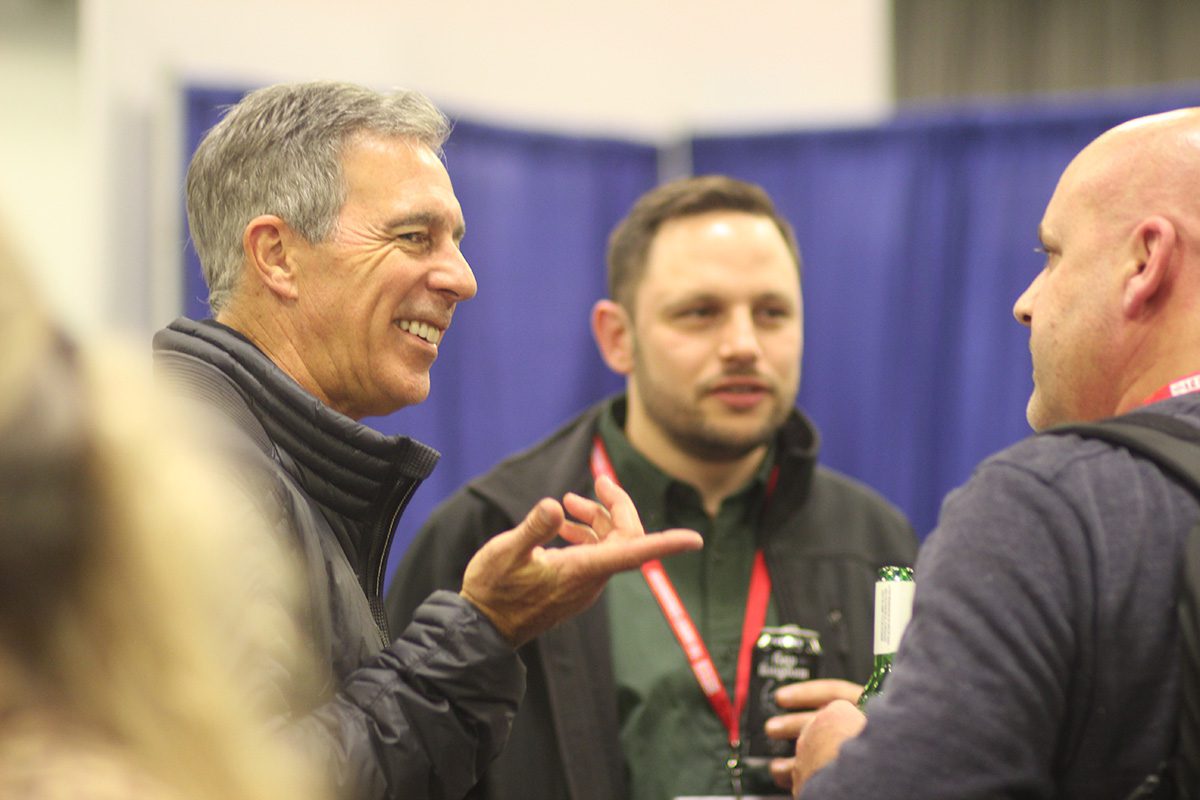 image of two men talking together