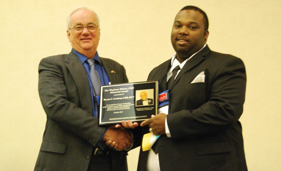 Cooksey receiving award