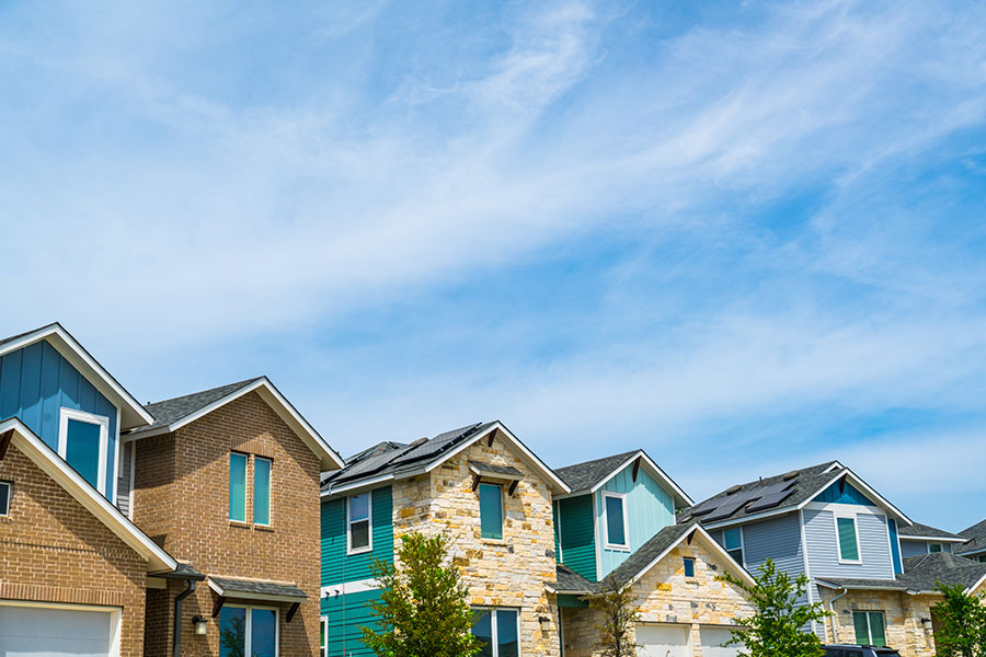 A row of homes with solar energy installed on the rooves