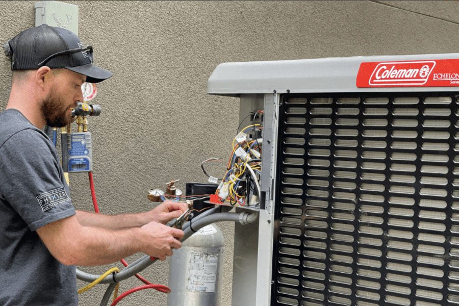 HVAC technician working on a heat pump