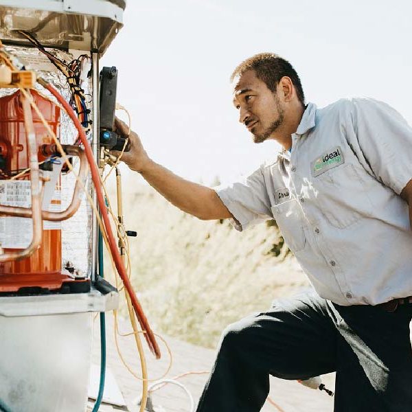 Photo of a man working on a project for Ideal Energy