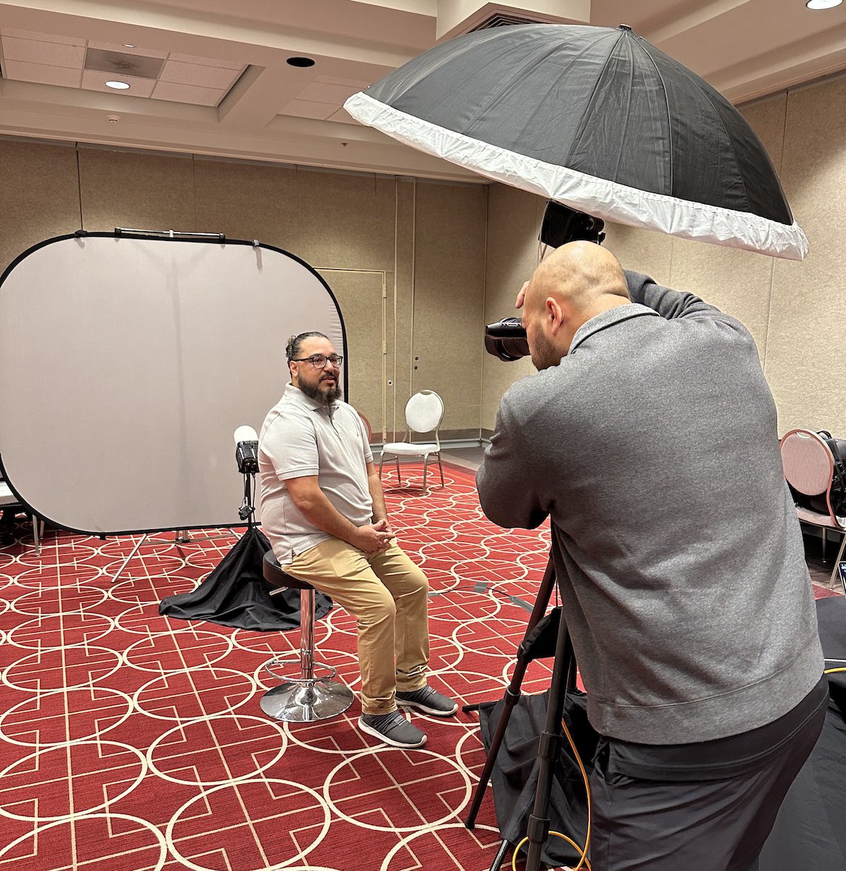 Image of a man taking a headshot