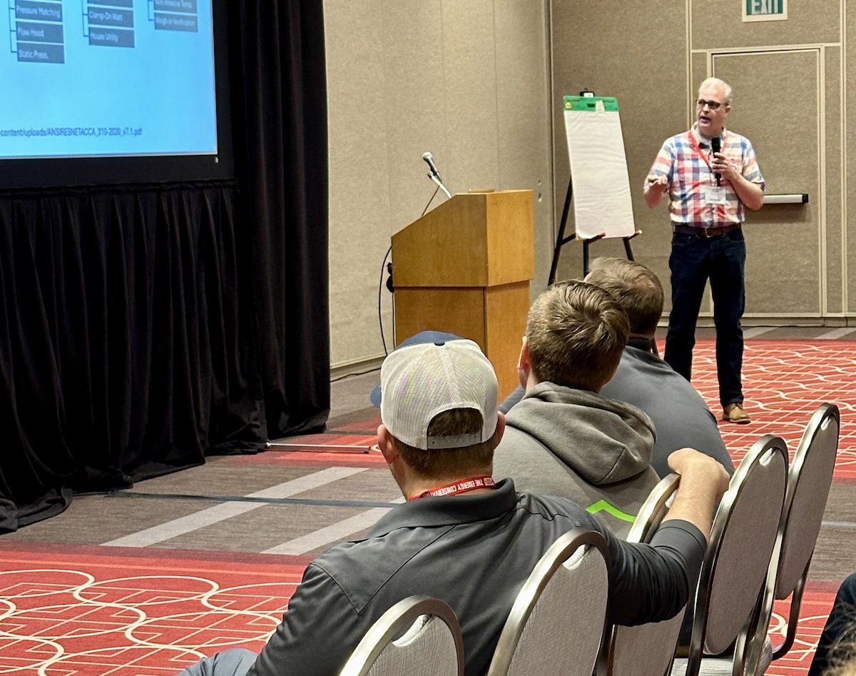 Image of a man presenting to a row of men