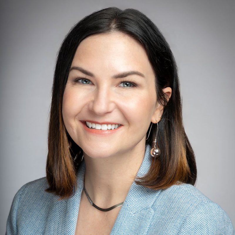 Smiling headshot of Katie Miller, Director of Marketing & Communications at the Building Performance Association. Taken in 2024