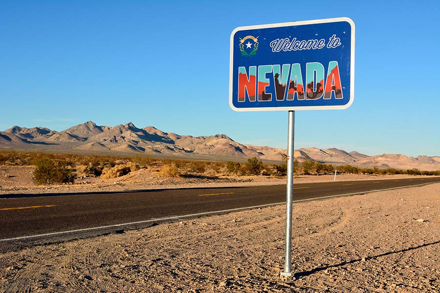 Welcome to Nevada road sign along a highway.