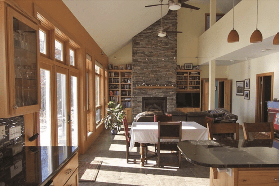 Kitchen with passive solar featuring a row of windows