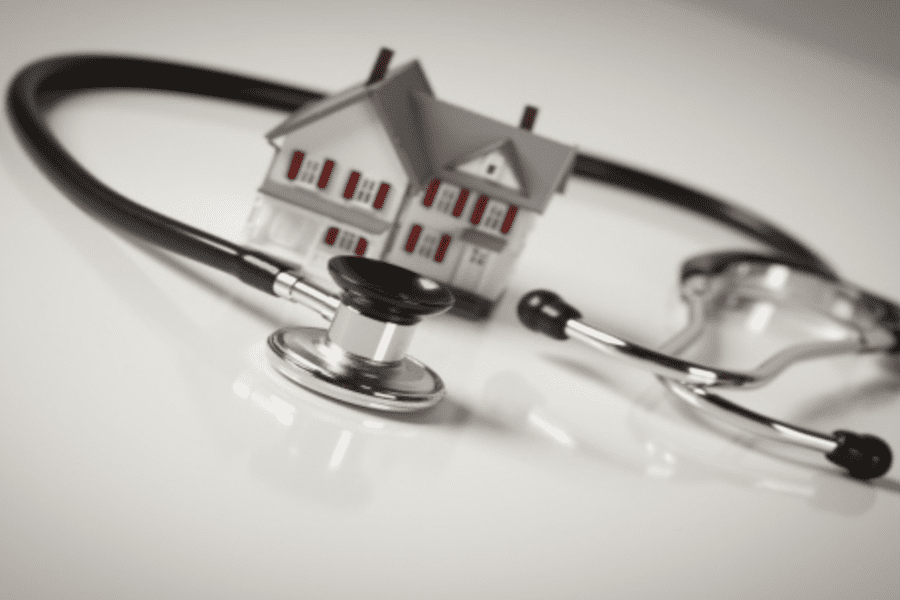 Stethescope surrounding a house