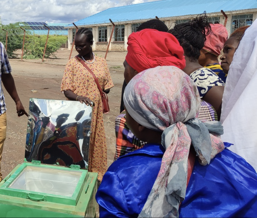 Grace* helped demonstrate solar cooking and trained new project participants. (Credit: Ecomandate Foundation)