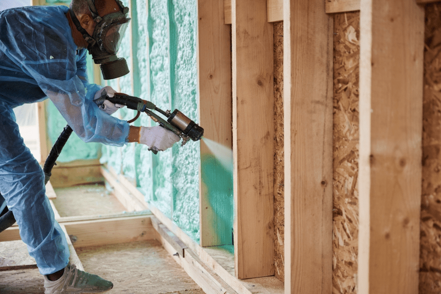 Tech applying spray foam insulation