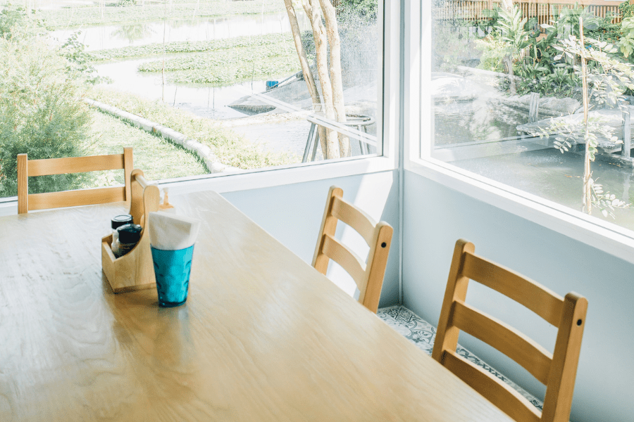 kitchen table with sun coming in through window by jcomp, Freepik